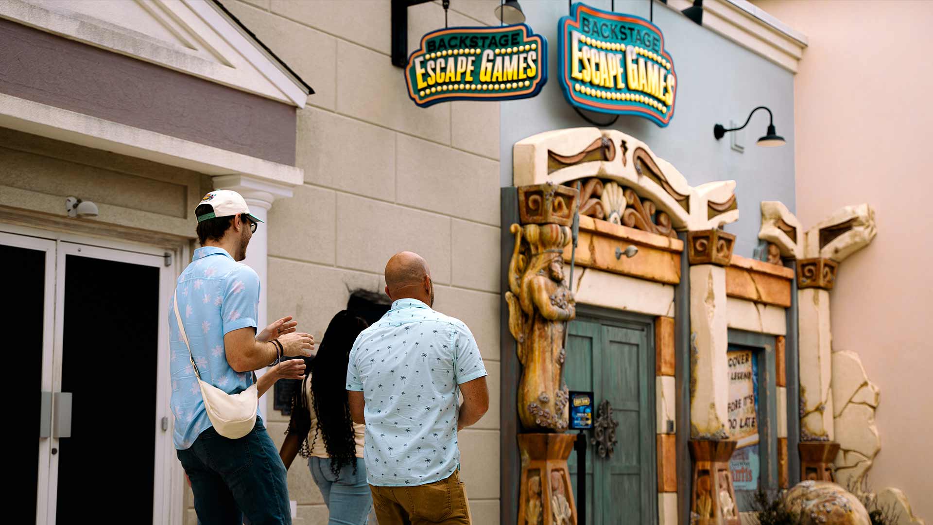 Image of three people smiling at Gatlin's Escape Games in Gatlinburg and Pigeon Forge, TN.